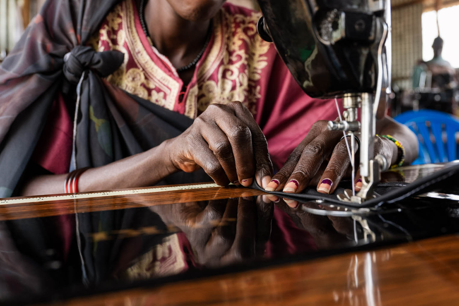 It takes time for the fingers and foot to work in sync, but three weeks in and Mary's confidence has grown with the foot-operated machine.