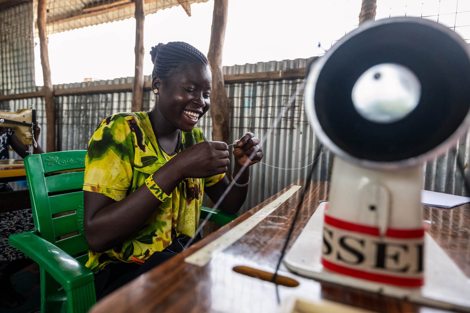 Through our tailoring class, displaced men and women are learning to sew and to smile again.