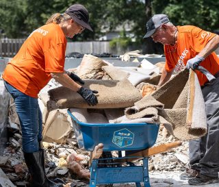 Volunteers have started work in Georgia, mudding-out flooded homes and removing strewn debris.