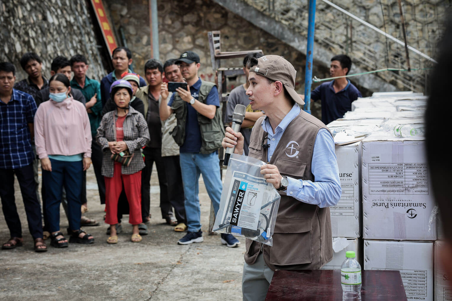 A Samaritan's Purse staff member instructs residents in the Cao Bang Province how to use the household water filtration kit.