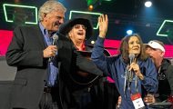 Mary Damron, and her son, Tad, join Samaritan’s Purse President Franklin Graham and artist Dennis Agajanian at the 2023 Global Connect conference in Orlando, Florida, to praise God for 30 years of Operation Christmas Child and 200 million shoebox gifts collected.