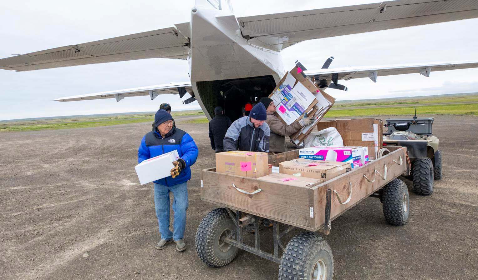 Samson Weston, at left, has been helping unload Samaritan's Purse planes as they arrive with volunteers and materials.