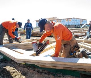 Volunteers working on the new church in Mekoryuk.