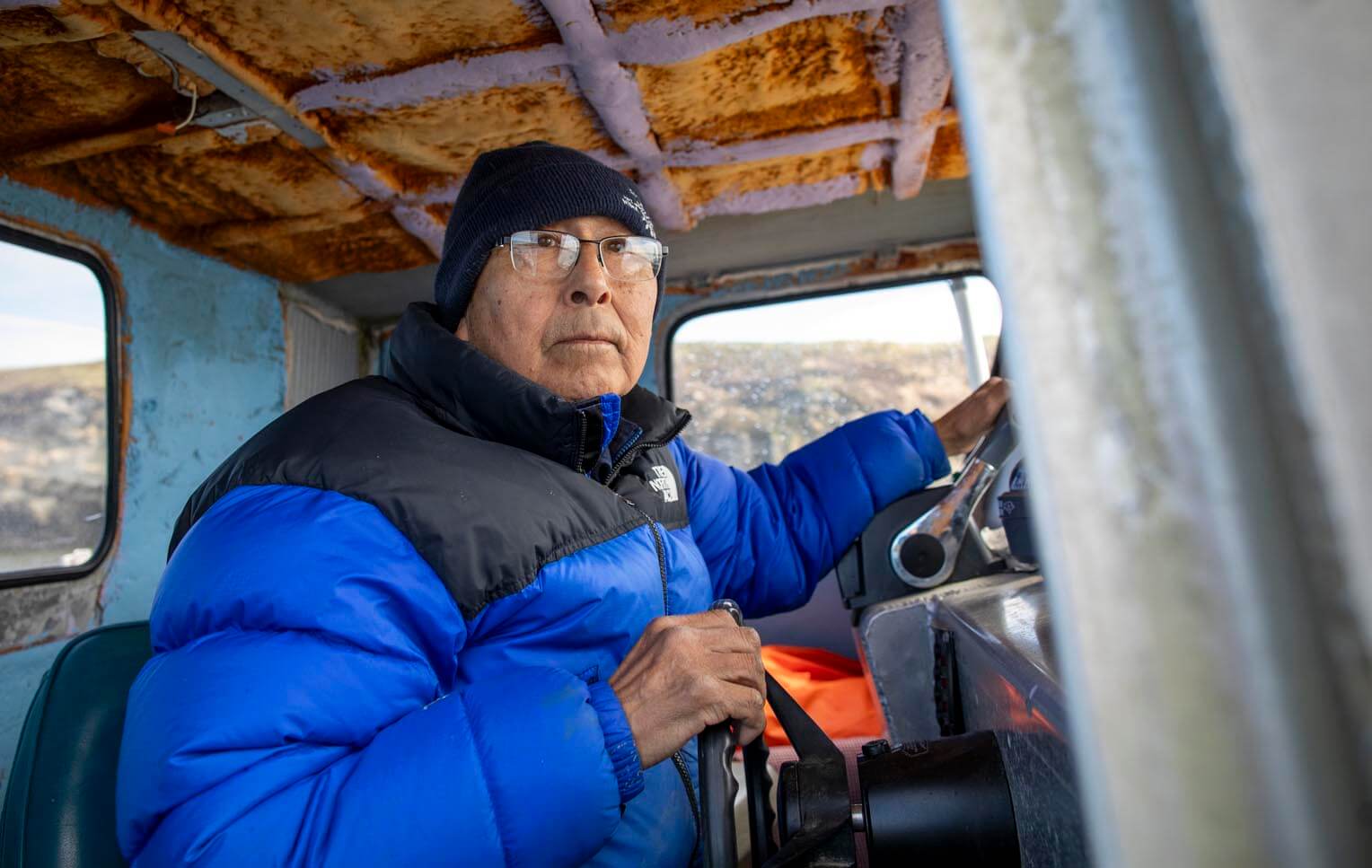 Samson Weston drives his boat around the island and along its rivers.