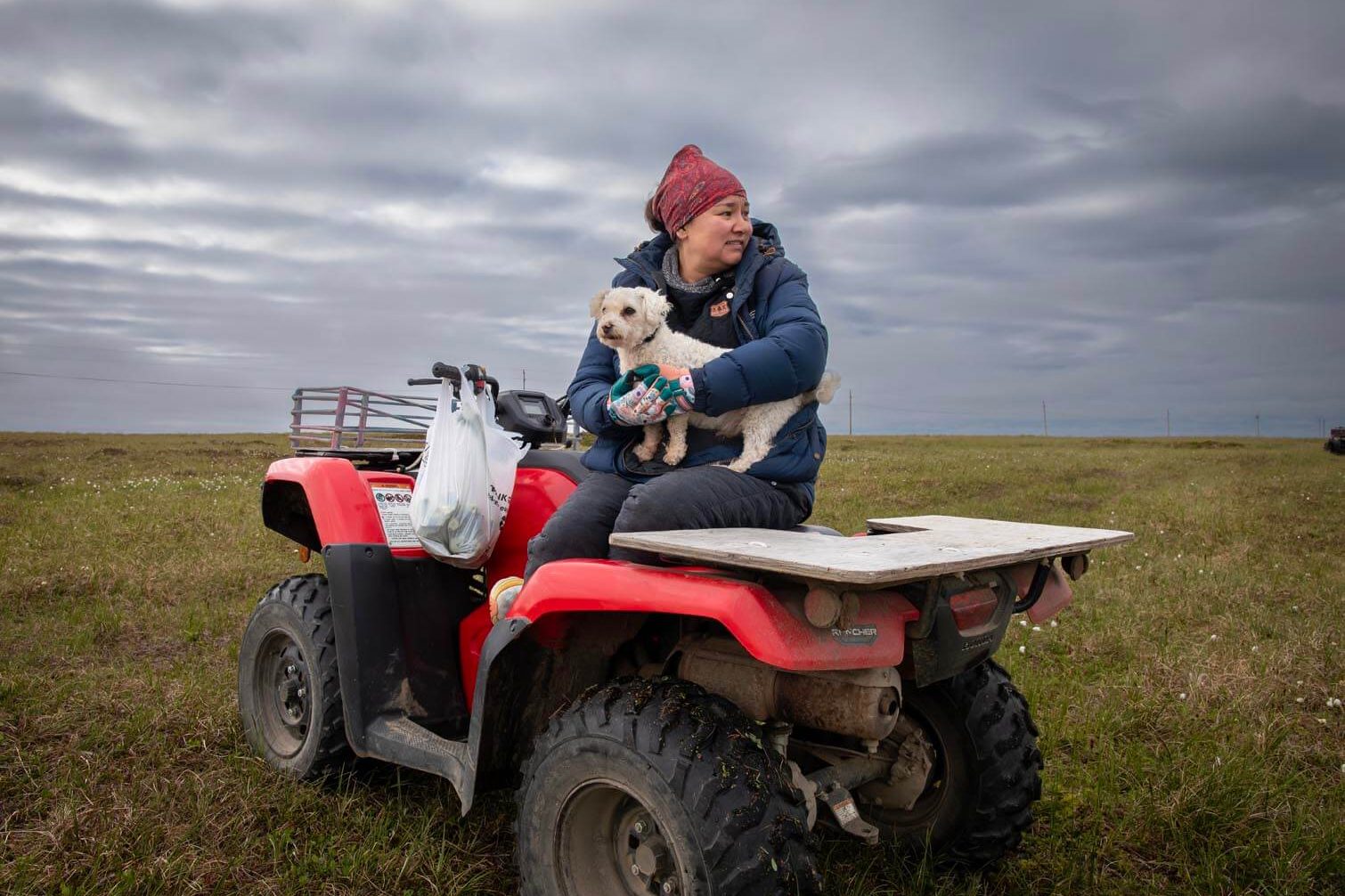 Bea Kiokun, Prudy Olrun's daughter, on her four-wheeler on the tundra of Nunivak Island.