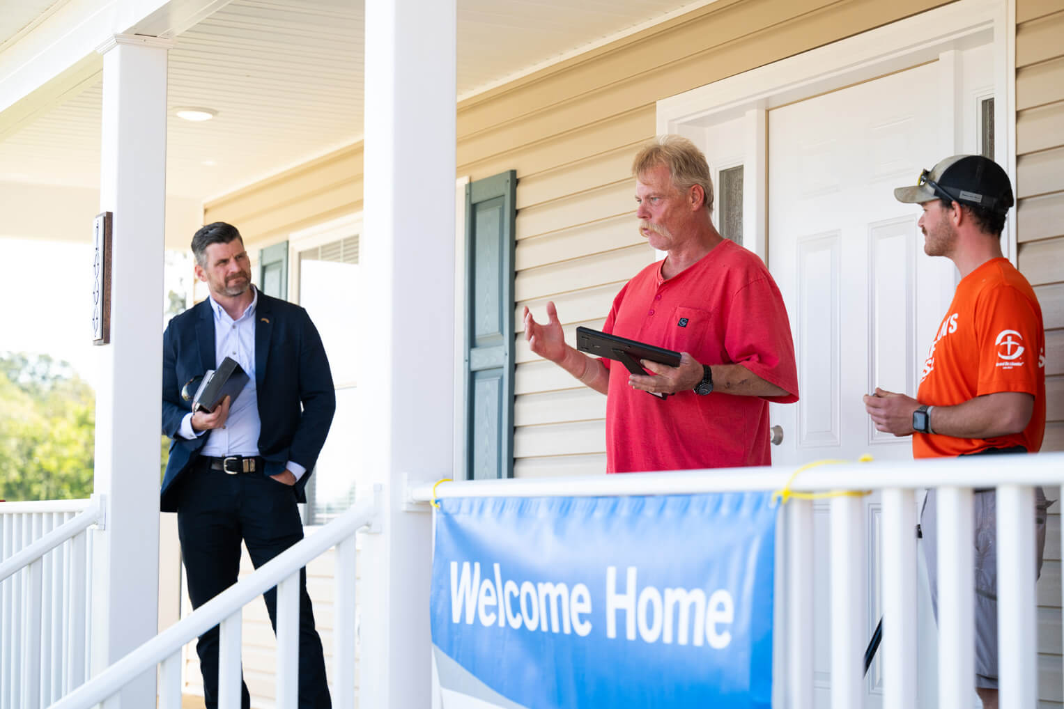 A homeowner expresses gratitude during dedication of his new home built by Samaritan's Purse.