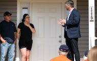 Samaritan's Purse COO Edward Graham welcomes a family to their new home.