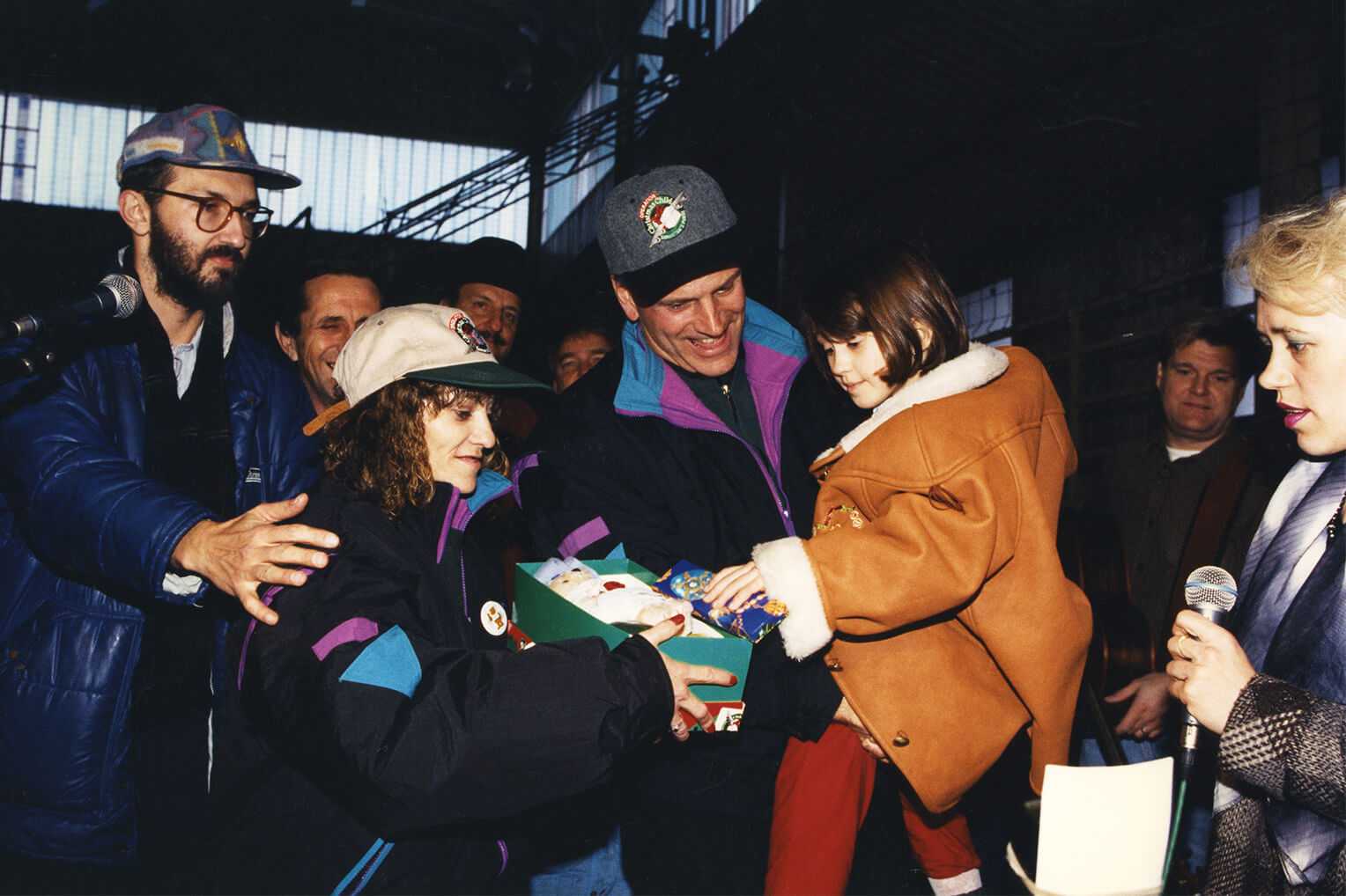 In 1995, Franklin Graham and Mary Damron deliver a shoebox gift packed by the First Family to a girl in Bosnia. 