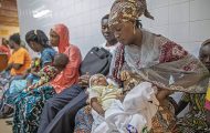 Mission hospital in Togo, woman holding child