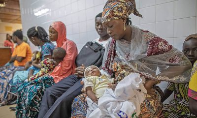 Mission hospital in Togo, woman holding child