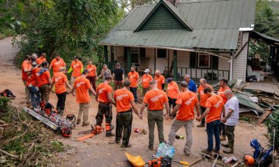 Samaritan's Purse volunteers gather to pray after working at a home in Buncombe County.