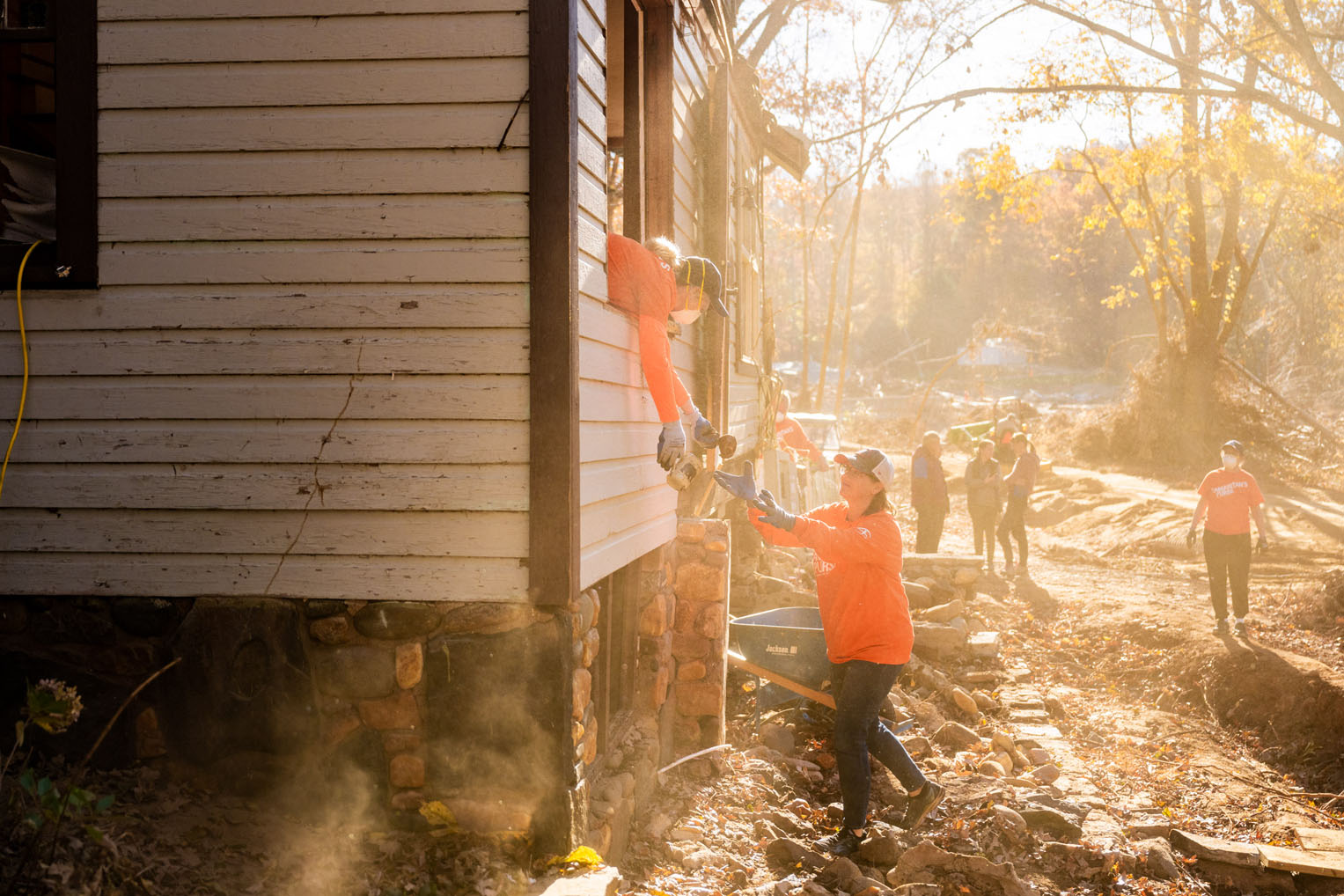 Dozens of volunteers showed up at the Wiebes' home to help them gather belongings and remove debris from their home.