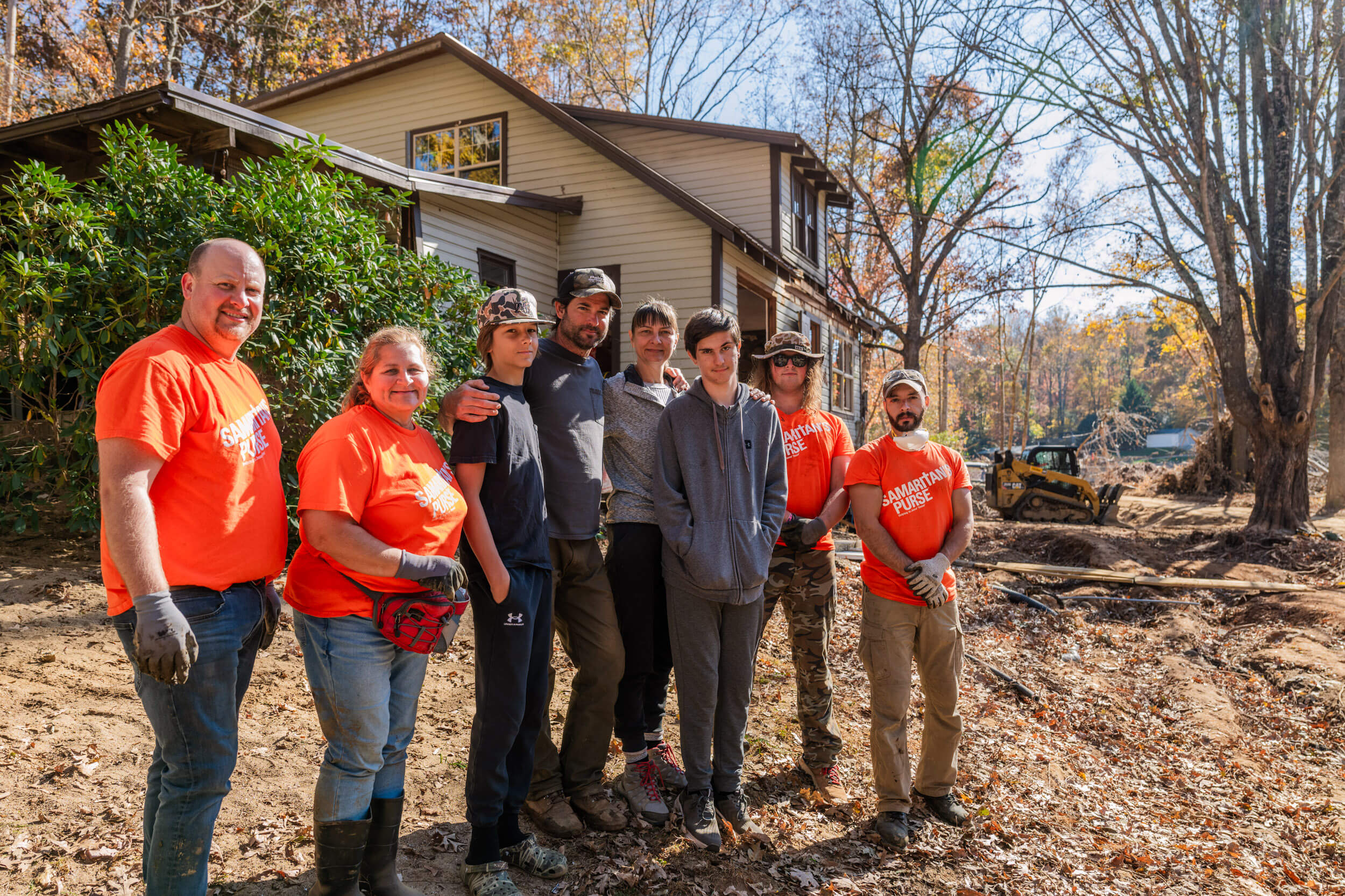 The Wiebes and volunteers gather after their work.