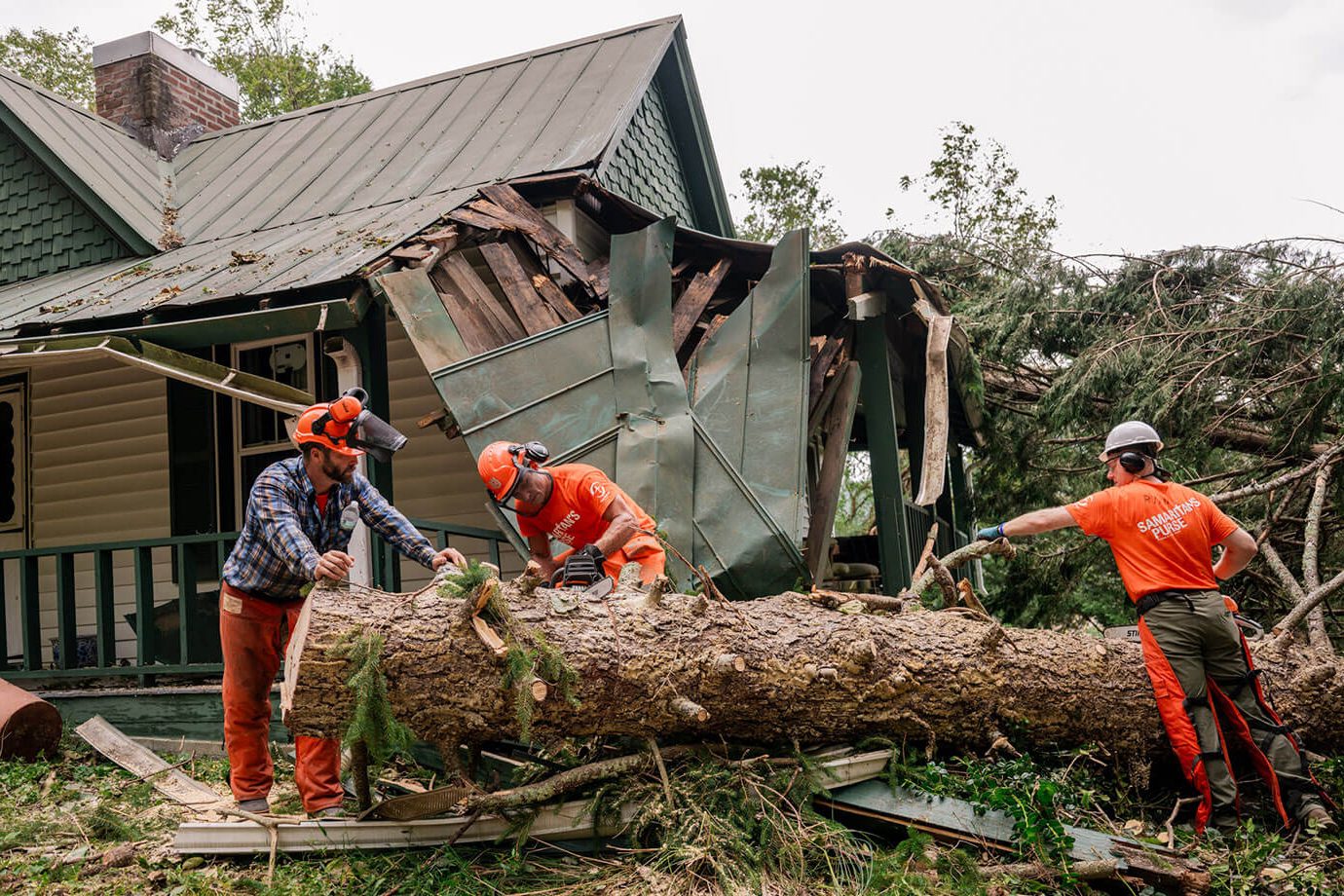 Volunteers are cutting up trees in Buncombe County, which was devastated by Hurricane Helene.