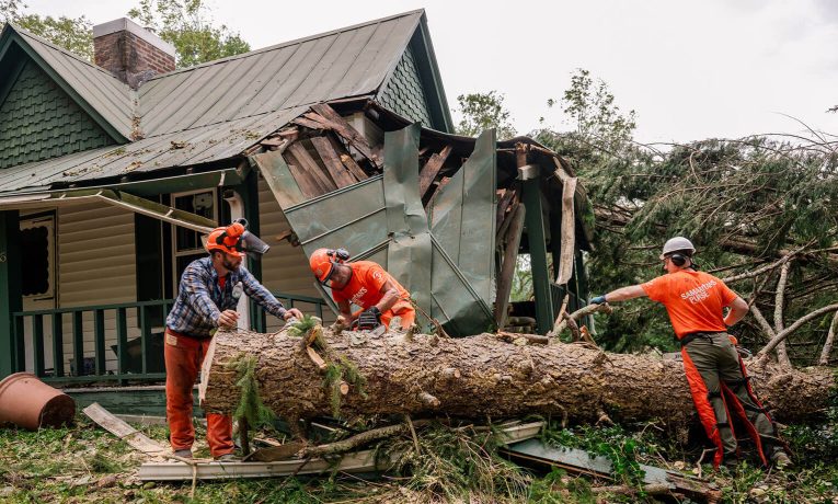 Volunteers are cutting up trees in Buncombe County, which was devastated by Hurricane Helene.