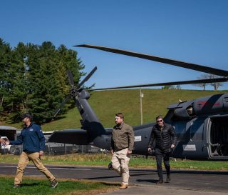 Edward Graham (right) and Donald Trump Jr (next to far left) flew over devastated areas of North Carolina.