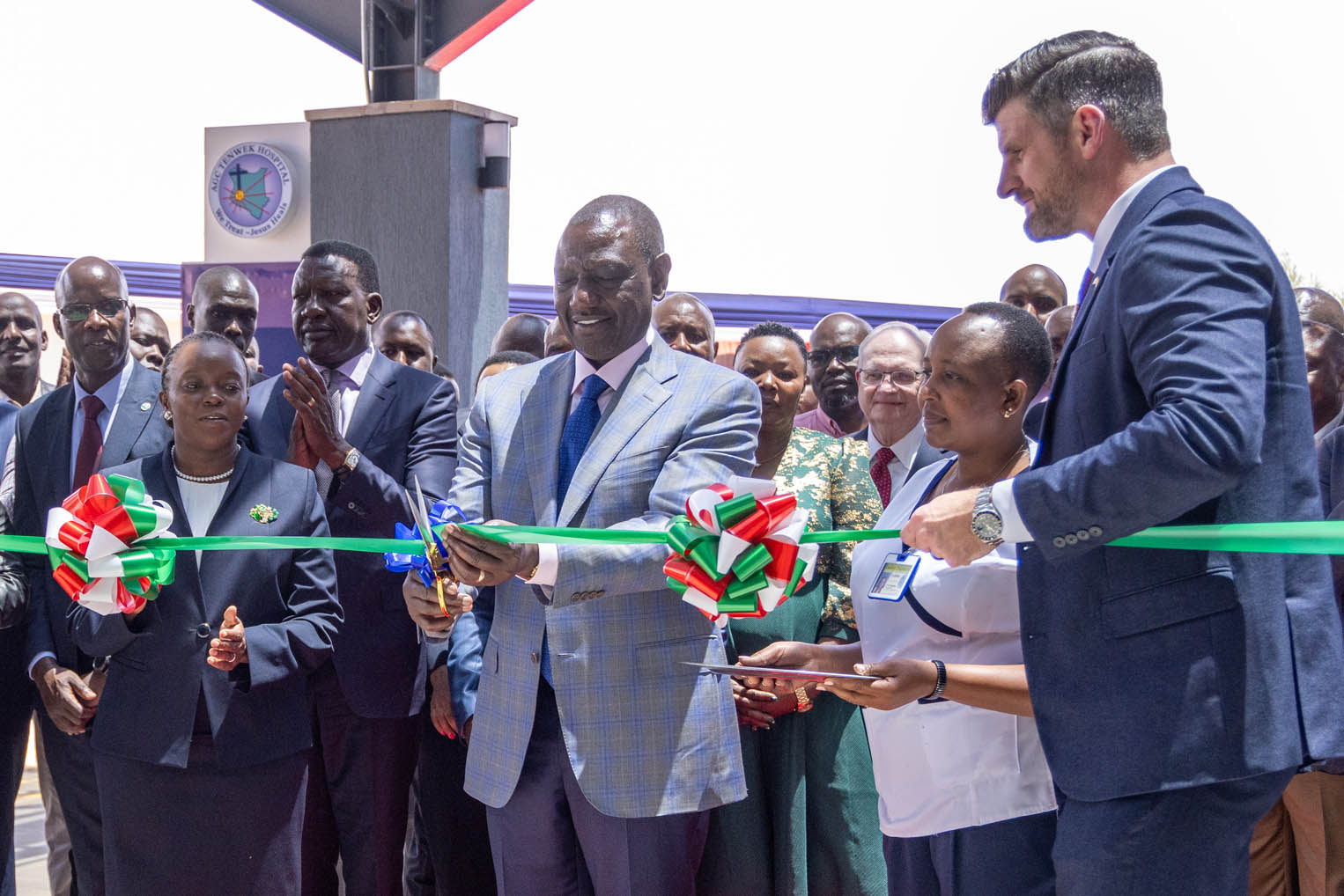 President Ruth of Kenya cuts the ribbon to signify the opening of the Tenwek Cardiothoracic Center. 