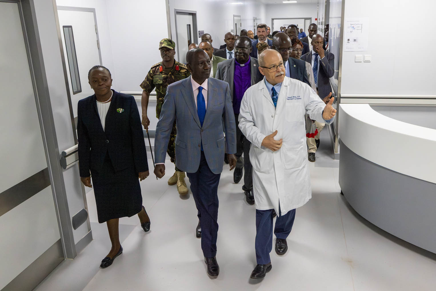 Dr. Russ White provides a tour of the new facility with visitors and dignitaries.