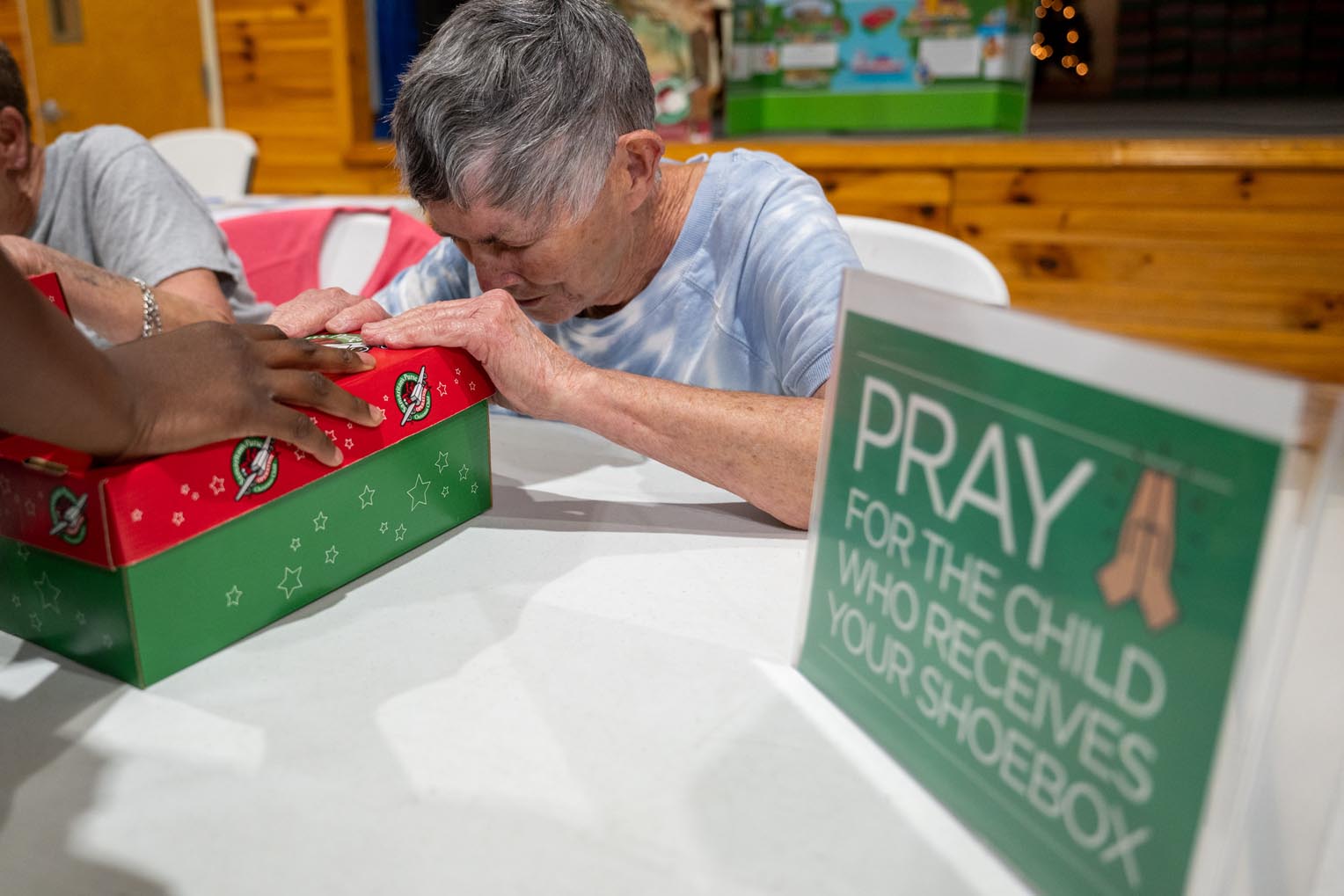 Volunteers pray over each thoughtfully packed shoebox gift.