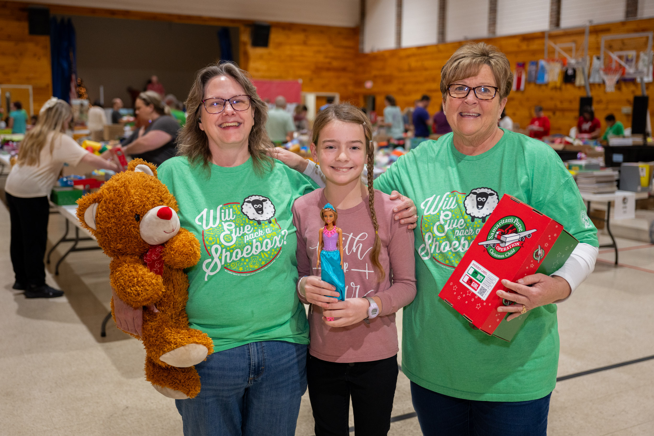 Lisa DeBusk, right, was overjoyed to help host a packing party with Angie Fritz, Operation Christmas Child project leader for First Baptist Damascus and young church member Jaz.