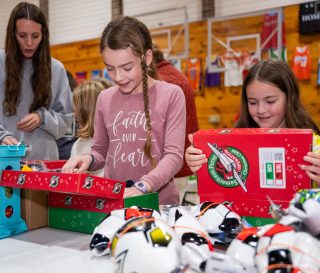 Packing Operation Christmas Child shoeboxes is one of 10-year-old Jaz's favorite activities each year at First Baptist Church Damascus, Virginia. Because her church flooded, a neighboring Glade Spring Baptist hosted a joint packing party with the two churches.