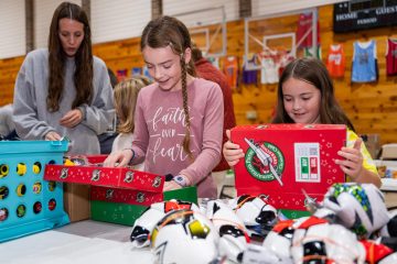 Packing Operation Christmas Child shoeboxes is one of 10-year-old Jaz's favorite activities each year at First Baptist Church Damascus, Virginia. Because her church flooded, a neighboring Glade Spring Baptist hosted a joint packing party with the two churches.