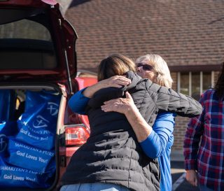 One resident expressed gratitude as she receives Thanksgiving meals from Samaritan's Purse.