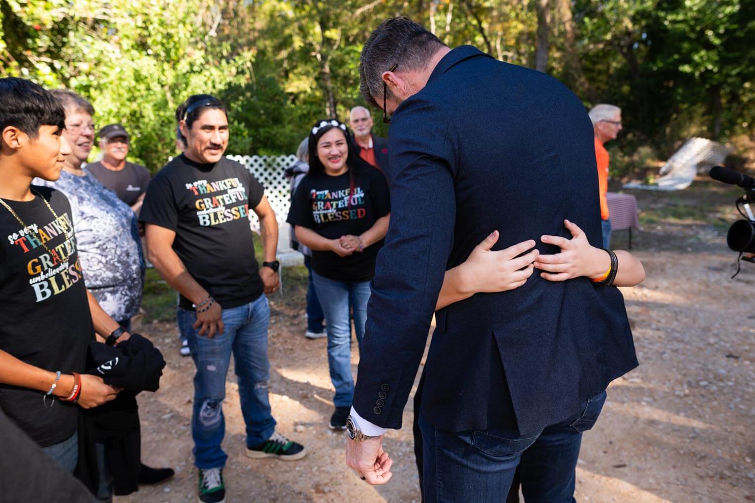 Graham receives more warm hugs from the young son.