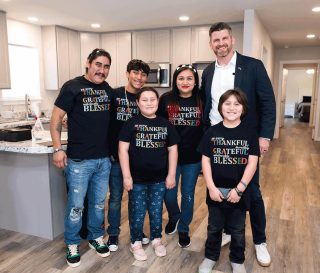 Samaritan's Purse COO joined the Avilas to celebrate the family's new home in Livingstone, Texas, that we provided this fall, 2024. The Avilas, shown here standing in their new kitchen with Edward Graham, lost their previous home during severe flooding in May 2024.