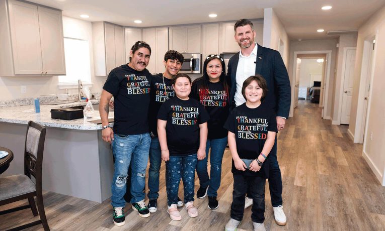 Samaritan's Purse COO joined the Avilas to celebrate the family's new home in Livingstone, Texas, that we provided this fall, 2024. The Avilas, shown here standing in their new kitchen with Edward Graham, lost their previous home during severe flooding in May 2024.