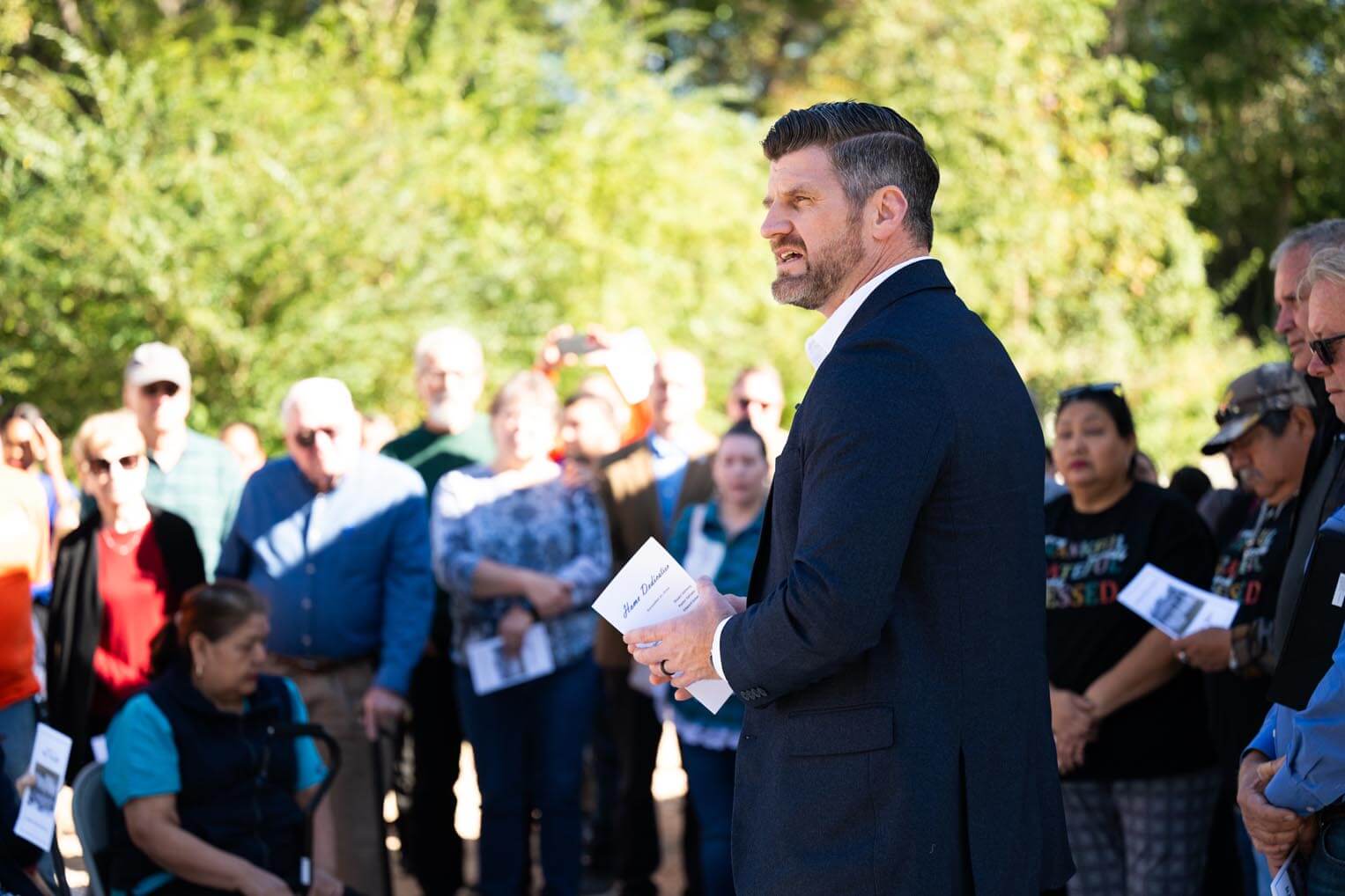 Graham dedicated the Avilas' new home, which replaced their paid-off home destroyed by floods in May.