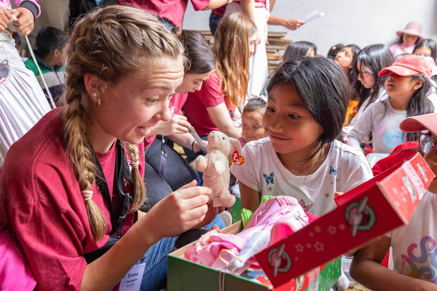 The Wheaton College students joined in the fun as children opened their shoebox gifts.