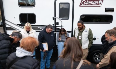 The Rays pray with our staff as we dedicate a camper to the Yancey County family.