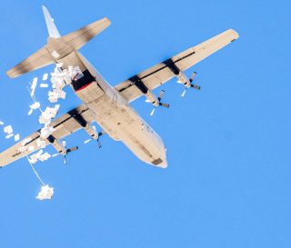 Food airdrops from a cargo plane provide lifesaving relief to areas without road access.