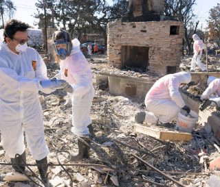 Volunteers search for keepsakes not claimed by the flames.