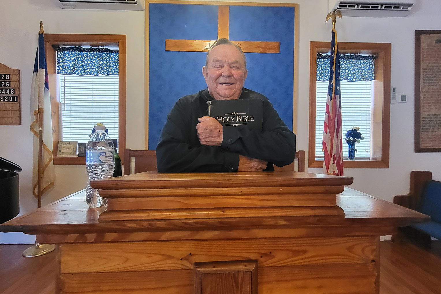 Charles English stood in the pulpit of his church, reopened for the first time months after the storm.