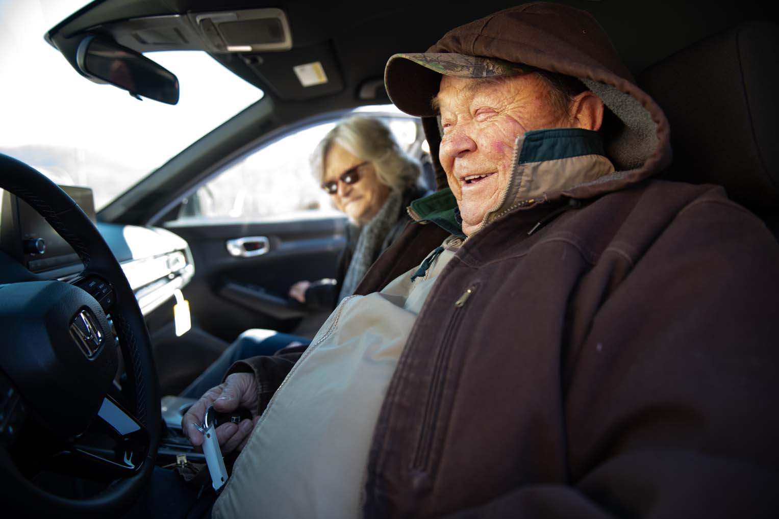 Charles and Sadie sit in their new car provided by Samaritan's Purse.