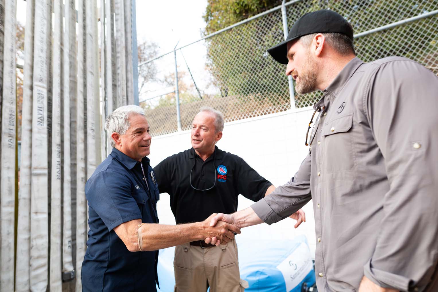 Pacific Palisades Fire Chief Robert Bates introduces Edward Graham to firefighters at a local station.