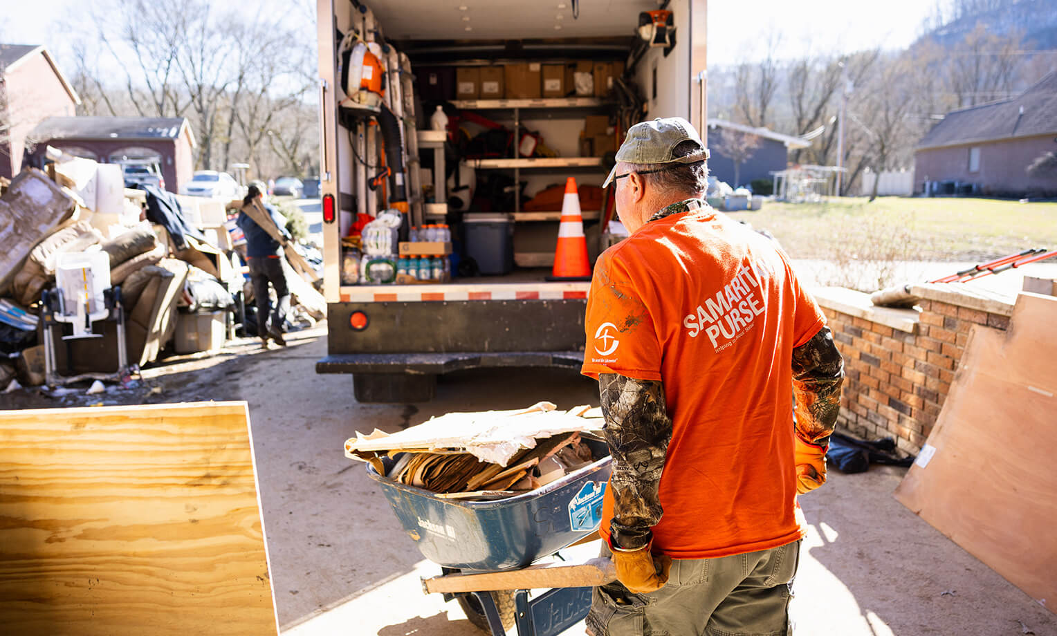 Volunteers are hard at work in Kentucky removing waterlogged belongings from homes. 