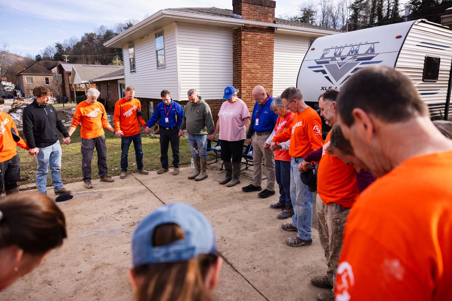 Teams are volunteering in Jesus' Name, taking every opportunity to minister to and pray with hurting families in the wake of the flood.