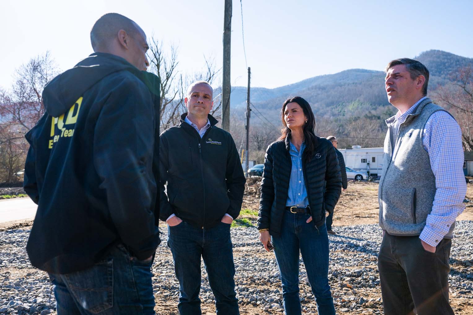 Cissie Graham Lynch and Will Graham, along with Jason Kimak, senior director of North American Ministries, met with homeowner Thanh Bui.