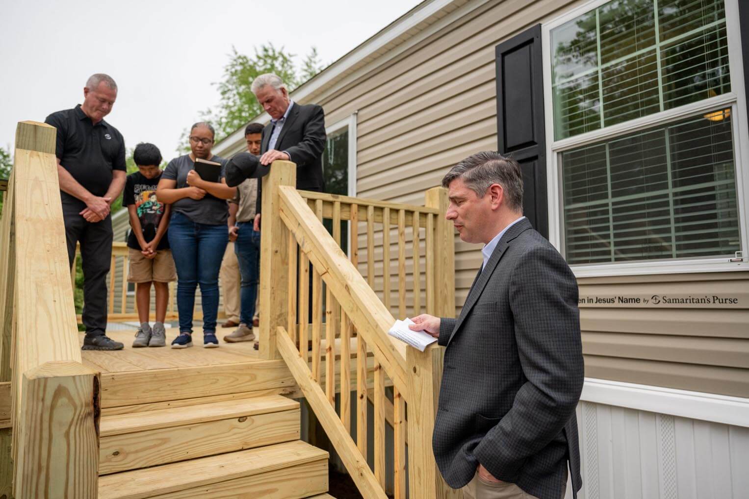 Will Graham, Franklin Graham's oldest son, prays at the dedication.