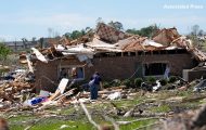 A home is destroyed after a severe storm passed the area on Saturday, May 17, 2025 in London, Kentucky.