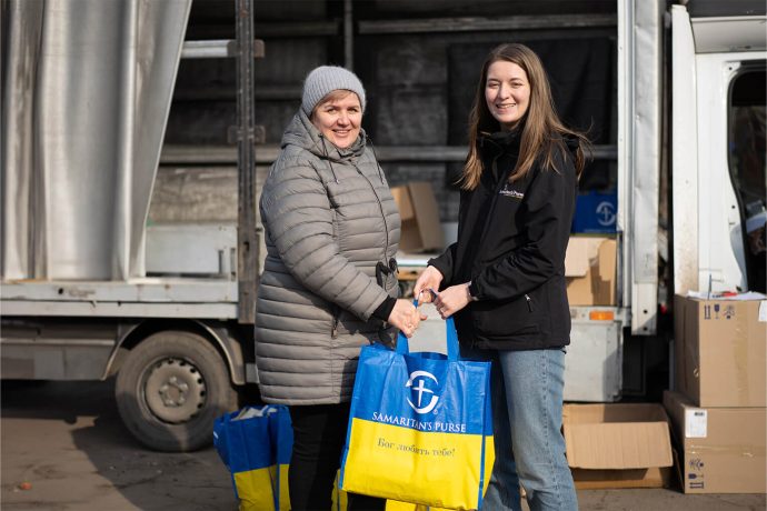 Ukrainian receives bag of supplies from Samaritan's Purse staff member