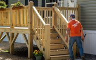 Samaritan's Purse volunteer in front of mobile home
