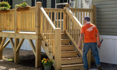 Samaritan's Purse volunteer in front of mobile home