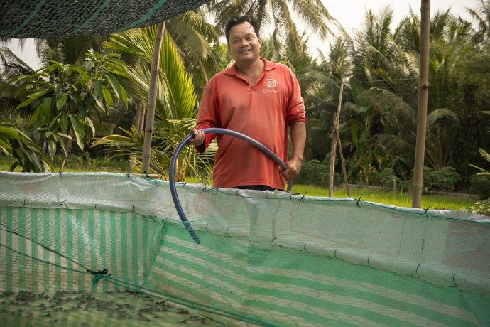 Income generated from Trang's farm of frogs is helping the father pay off overdue debts and provide for his family. 