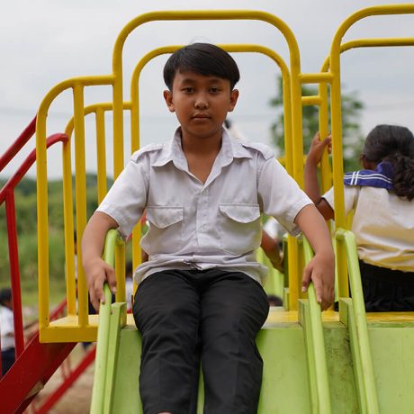 boy on playground equipment