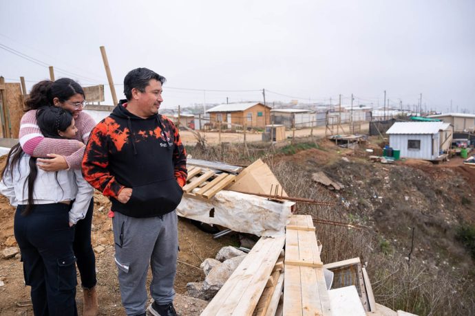 Family surveys neighborhood damage