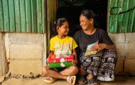 mother and daughter with shoebox gift and Gospel booklet